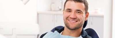 man smiling before dental procedure